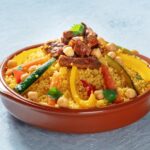 Meat and vegetable couscous in a bowl, typical food from Morocco